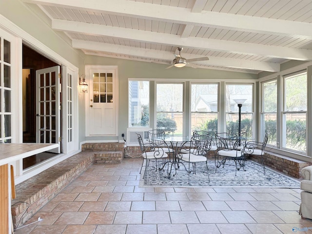 unfurnished sunroom featuring wood ceiling and beam ceiling