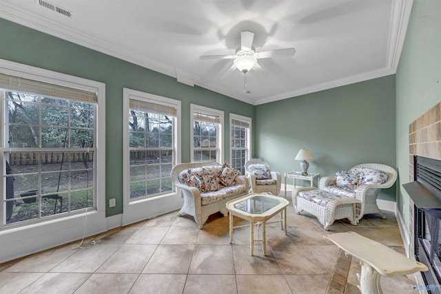 sunroom / solarium featuring ceiling fan