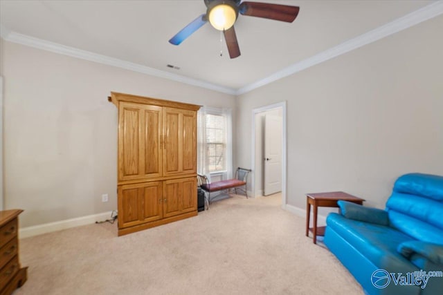 living area with ceiling fan, crown molding, and light carpet