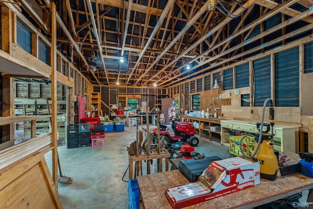 251 Wells St, Mentone, AL 35984 - miscellaneous room with a workshop area and unfinished concrete floors