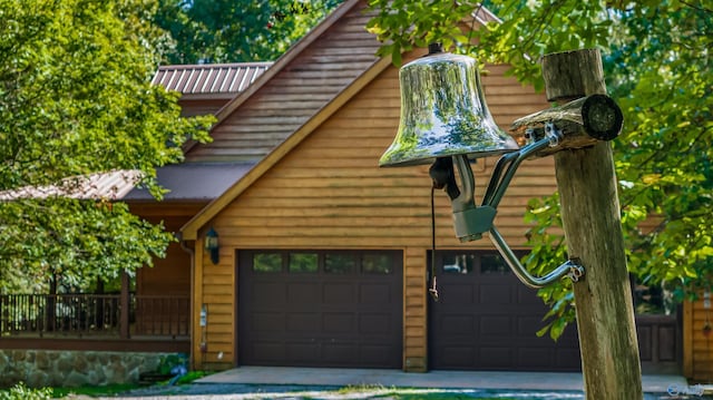 view of front of house featuring a garage and metal roof