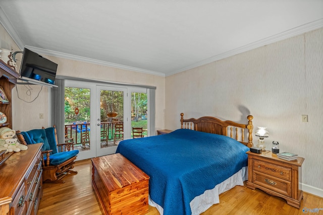 bedroom featuring crown molding, hardwood / wood-style floors, french doors, and access to outside