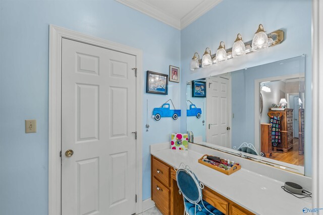 bathroom featuring crown molding, vanity, and hardwood / wood-style flooring