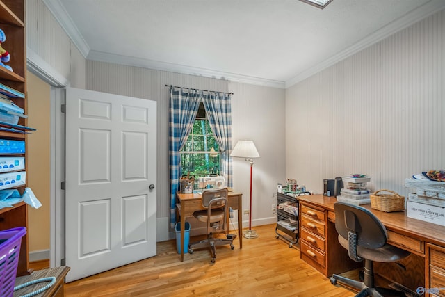 office space featuring light wood-type flooring and crown molding