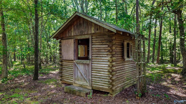 view of shed featuring a forest view