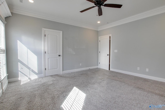 carpeted spare room with ornamental molding, recessed lighting, ceiling fan, and baseboards