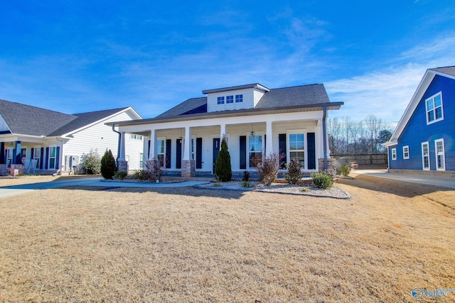 view of front of house with a porch and a front lawn