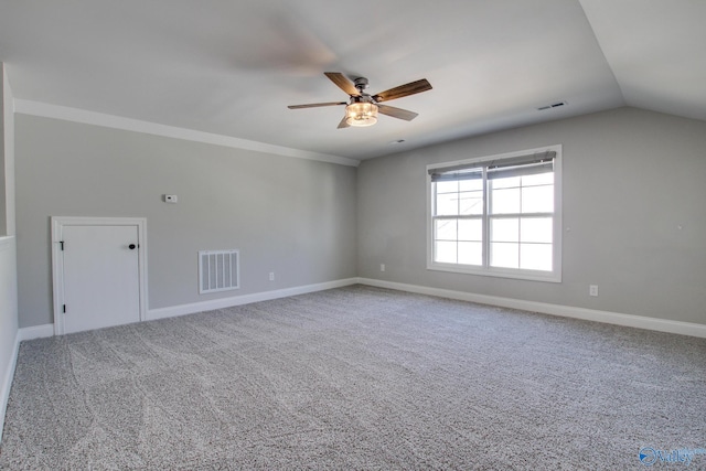 additional living space featuring carpet, visible vents, and ceiling fan