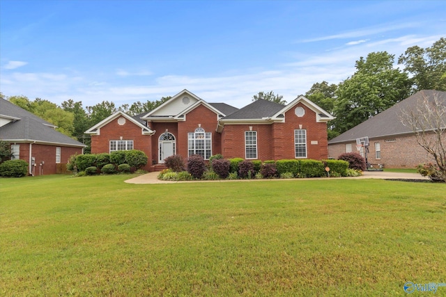 single story home with a front yard