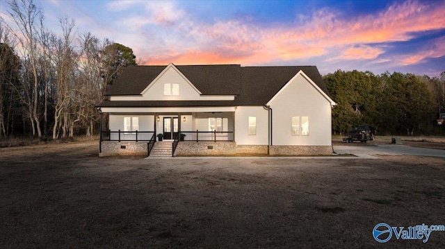 view of front of home featuring a porch and crawl space