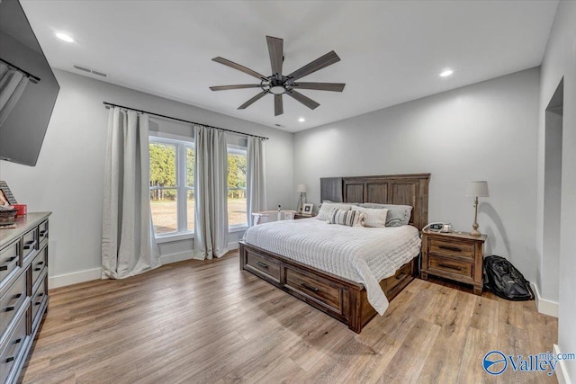 bedroom featuring baseboards, light wood finished floors, a ceiling fan, and recessed lighting