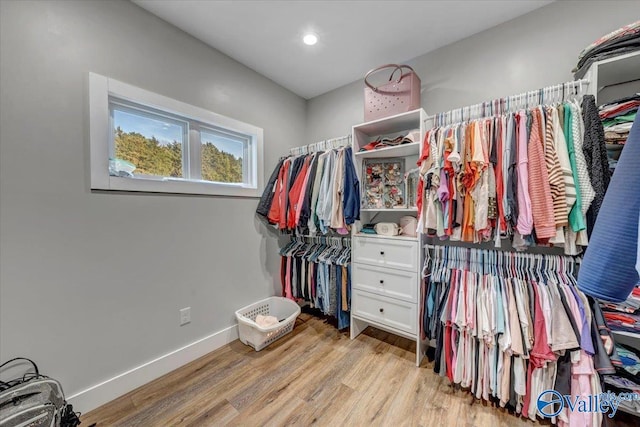 spacious closet with light wood-style floors