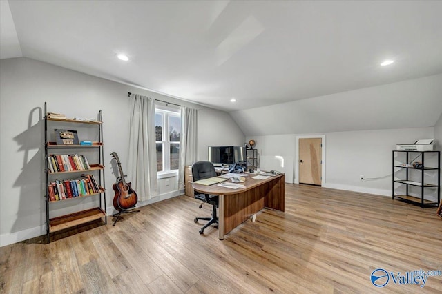 home office with lofted ceiling, recessed lighting, light wood-style flooring, and baseboards