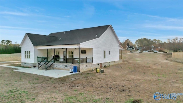 rear view of house featuring crawl space, a porch, and a patio