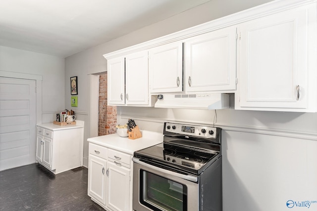 kitchen featuring stainless steel electric range and white cabinets