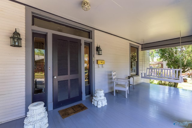 property entrance featuring covered porch