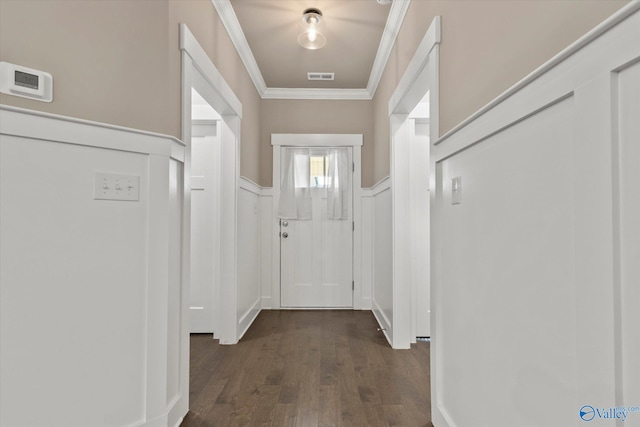 entryway with crown molding and dark hardwood / wood-style floors