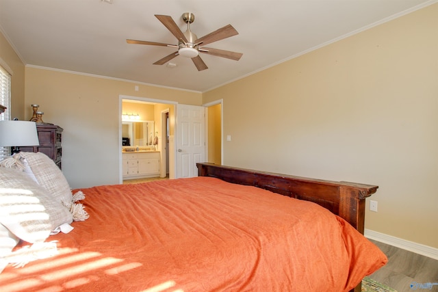 bedroom featuring ensuite bath, wood-type flooring, ornamental molding, and ceiling fan