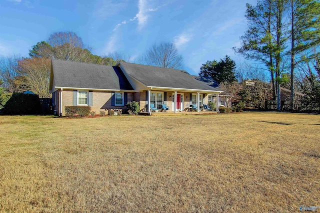 single story home featuring a front lawn and covered porch