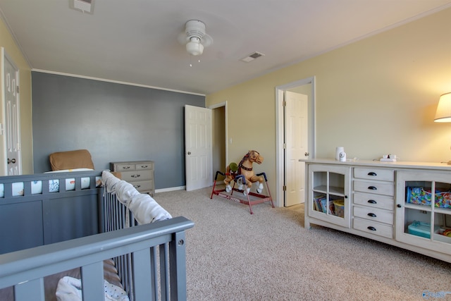 carpeted bedroom with ceiling fan