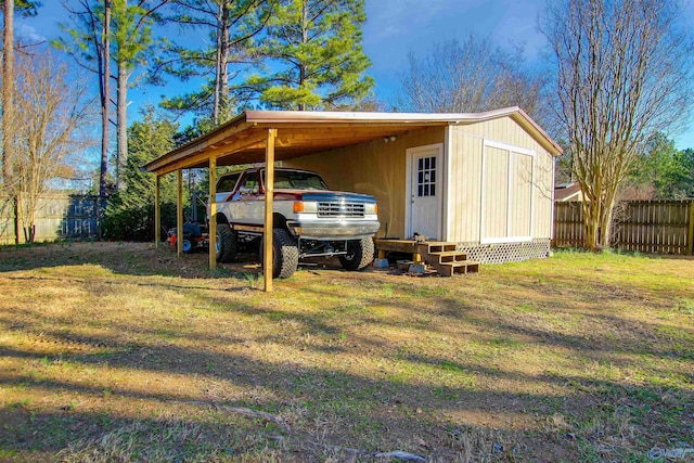 view of outbuilding with a yard and a carport