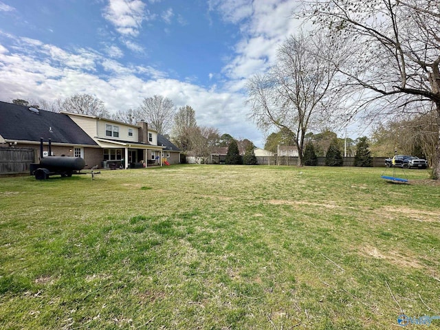 view of yard with fence