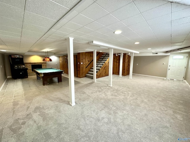 finished below grade area with carpet, pool table, baseboards, and stairs