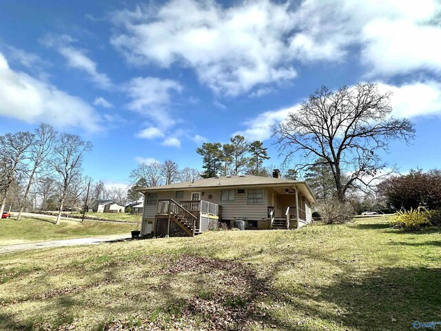 back of property with a yard