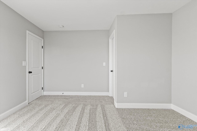 empty room with light colored carpet