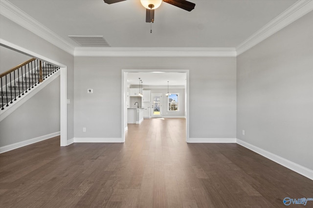 unfurnished living room featuring ornamental molding, ceiling fan, dark wood-type flooring, and sink