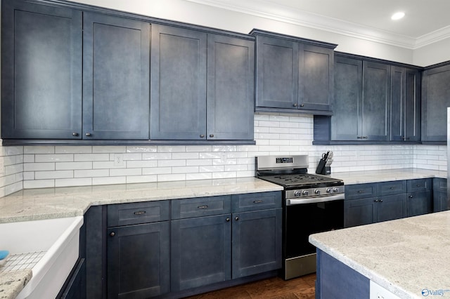 kitchen featuring dark wood finished floors, crown molding, backsplash, light stone countertops, and stainless steel gas range