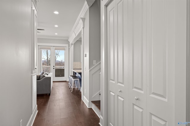 corridor featuring ornamental molding, dark wood-type flooring, and recessed lighting