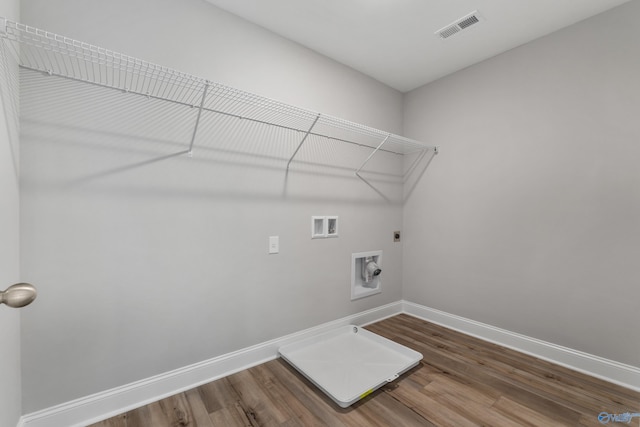 laundry room with hardwood / wood-style floors, hookup for a washing machine, and electric dryer hookup