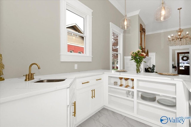 bathroom featuring sink and a notable chandelier