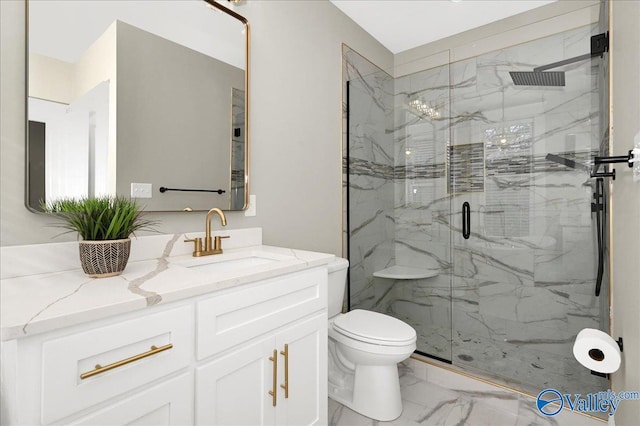 bathroom with vanity, toilet, and walk in shower