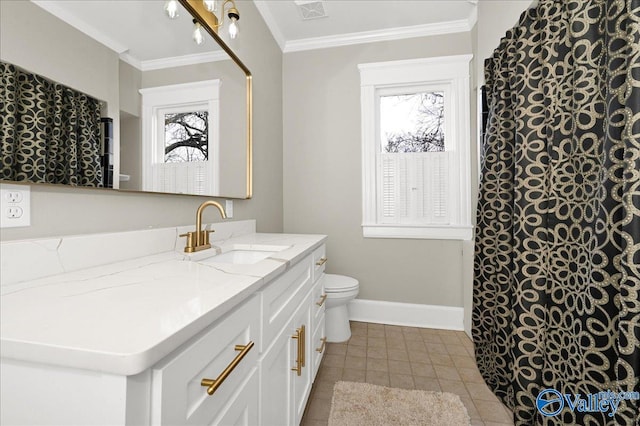 bathroom with tile patterned flooring, toilet, vanity, and ornamental molding