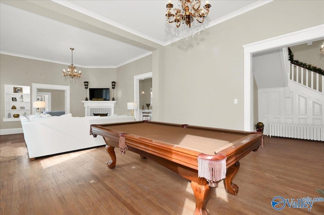 recreation room featuring radiator, crown molding, wood-type flooring, a chandelier, and pool table