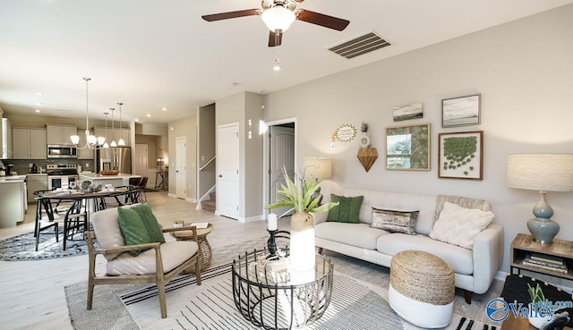 211 Bent Creek Ln, New Market, AL 35761 - living area featuring ceiling fan, light wood-style floors, baseboards, recessed lighting, and a chandelier