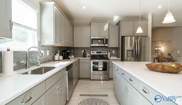 211 Bent Creek Ln, New Market, AL 35761 - kitchen featuring appliances with stainless steel finishes, gray cabinetry, a sink, hanging light fixtures, and recessed lighting