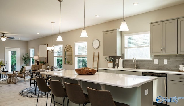 211 Bent Creek Ln, New Market, AL 35761 - kitchen featuring a sink, stainless steel dishwasher, gray cabinetry, healthy amount of natural light, and recessed lighting