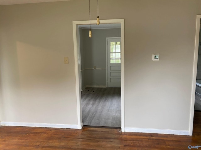 empty room featuring dark hardwood / wood-style floors