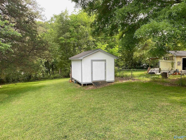 view of outdoor structure featuring a lawn