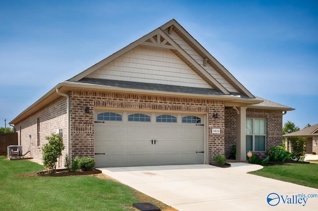 14614 Demarie Ln, Athens, AL 35613 - view of front of property featuring brick siding, concrete driveway, a garage, and a front yard