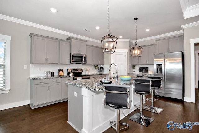 14614 Demarie Ln, Athens, AL 35613 - kitchen featuring stainless steel appliances, gray cabinetry, decorative backsplash, ornamental molding, and recessed lighting