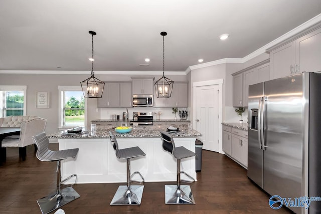 14614 Demarie Ln, Athens, AL 35613 - kitchen featuring appliances with stainless steel finishes, gray cabinets, light stone countertops, dark wood-type flooring, and crown molding