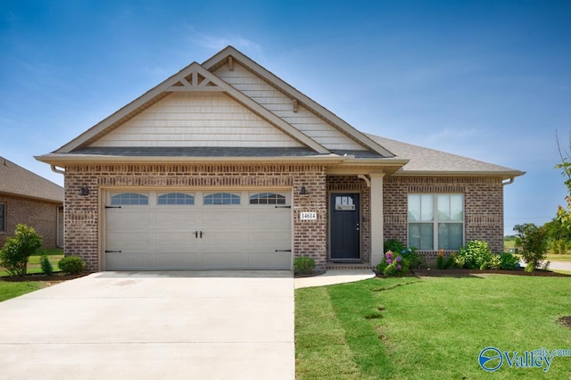 14614 Demarie Ln, Athens, AL 35613 - view of front of property featuring brick siding, a front lawn, a garage, driveway, and a shingled roof