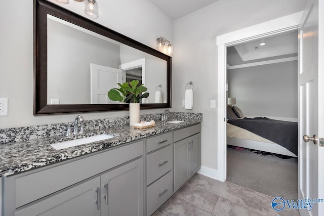 14614 Demarie Ln, Athens, AL 35613 - ensuite bathroom featuring double vanity and baseboards