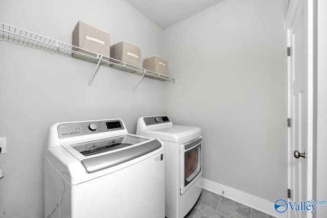 14614 Demarie Ln, Athens, AL 35613 - washroom featuring separate washer and dryer and light tile patterned flooring