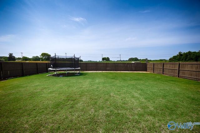 14614 Demarie Ln, Athens, AL 35613 - fenced backyard with a trampoline