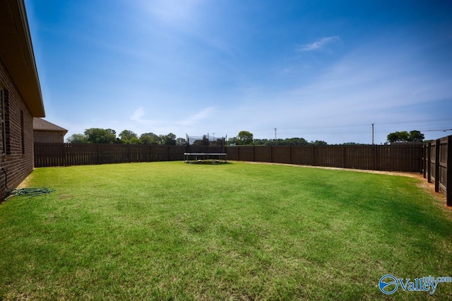 14614 Demarie Ln, Athens, AL 35613 - fenced backyard featuring a trampoline